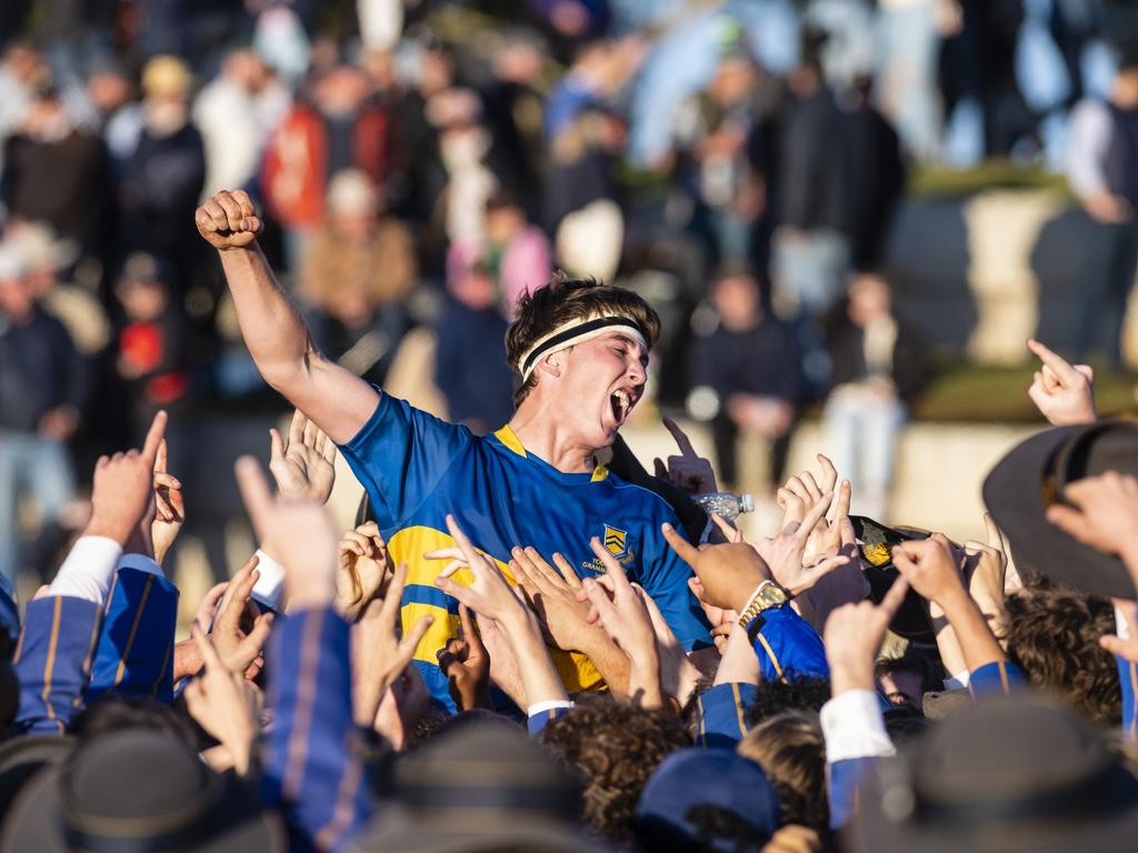 TGS First XV captain Charlie Horn is lifted by the student body in celebration after defeating Downlands to claim the O'Callaghan Cup on Grammar Downlands Day at Downlands College, Saturday, August 6, 2022. Picture: Kevin Farmer