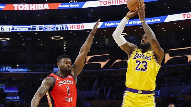 *** BESTPIX *** LOS ANGELES, CALIFORNIA - MARCH 04: LeBron James #23 of the Los Angeles Lakers shoots a 3-point basket to score his 50,002   NBA regular season and playoff career points during the first half against Zion Williamson #1 of the New Orleans Pelicans at Crypto.com Arena on March 04, 2025 in Los Angeles, California. NOTE TO USER: User expressly acknowledges and agrees that, by downloading and or using this photograph, User is consenting to the terms and conditions of the Getty Images License Agreement. (Photo by Ronald Martinez/Getty Images)