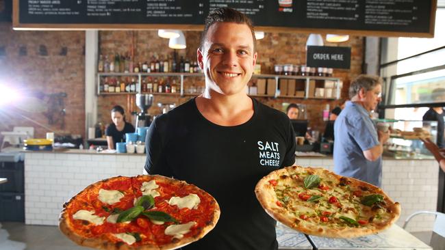 Stefano De Blasi of Salt Meats Cheese with some of their mouth-watering pizzas at the Broadway store.