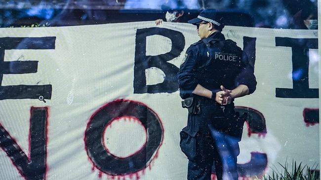 Police are on the scene with the protesters outside St Thomas’ Anglican Church. Picture: NewsWire / Monique Harmer