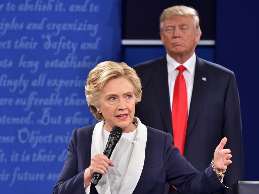 Donald Trump listens to Hillary Clinton during a debate in 2016. Picture: Paul Richards (AFP)