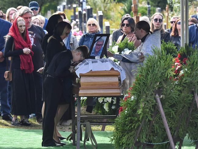 An Orthodox priest conducts a funeral service at the coffin of Valery Chekalov, a senior deputy of Wagner private mercenary group chief Yevgeny Prigozhin. Picture: AFP