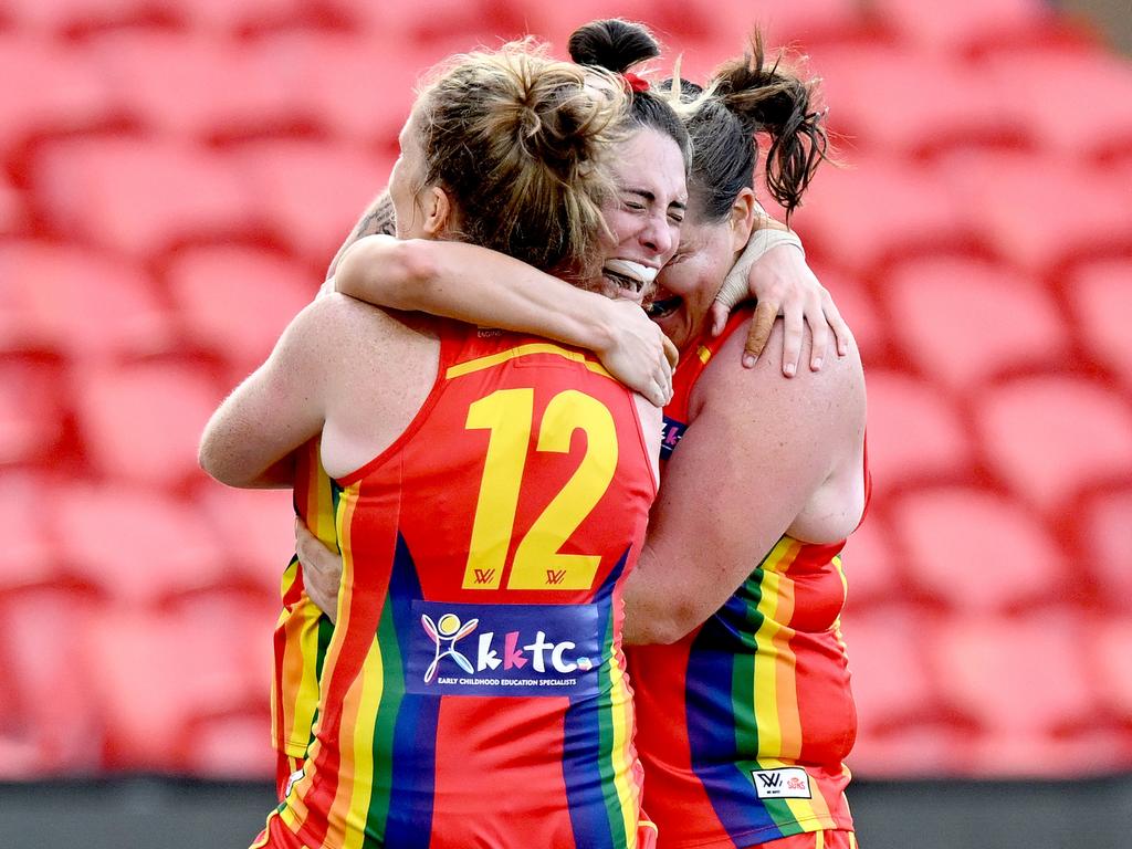 The Suns celebrate the win. Picture: Bradley Kanaris/Getty