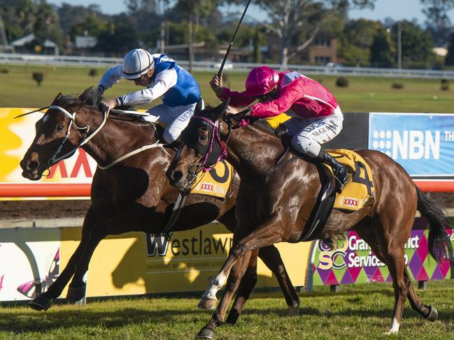 Evopex (outside) ridden by Matt McGuren kicks past Cool Prince ridden by Ben Looker to win the Maclean Cup.