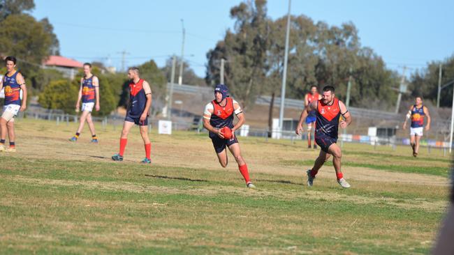 Warwick Redbacks co-captain Andrew Bardsley (in possession) hopes to lead his team to victory this weekend.