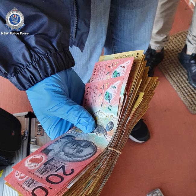 Tuggerah Lakes Police officers attached to Strike Force Harle seized drugs and $210,000 in cash in eight raids across the Central Coast. Picture: NSW Police