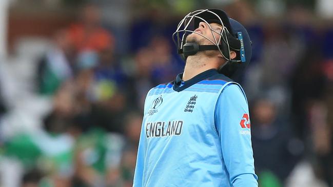 England's Joe Root reacts as he walks back to the pavilion after losing his wicket for 107 during the 2019 Cricket World Cup group stage match between England and Pakistan at Trent Bridge in Nottingham, central England, on June 3, 2019. (Photo by Lindsey PARNABY / AFP) / RESTRICTED TO EDITORIAL USE