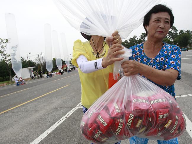 North Korean defectors prepare to release a balloon en route to the North, carrying chocolate pies. Picture: Ahn Young-joon