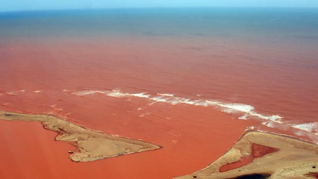 Toxic waste flows into the ocean after the dam collapse. Picture: AFP