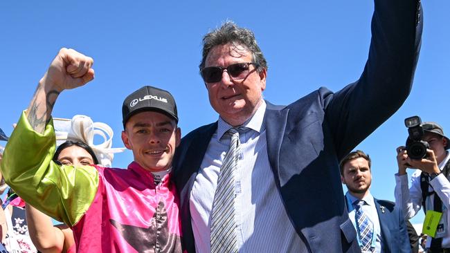 MELBOURNE, AUSTRALIA - NOVEMBER 05: Robbie Dolan poses with trainer John Symons after  Knight's Choice won Race 7, the Lexus Melbourne Cup - Betting Odds during Melbourne Cup Day at Flemington Racecourse on November 05, 2024 in Melbourne, Australia. (Photo by Vince Caligiuri/Getty Images)