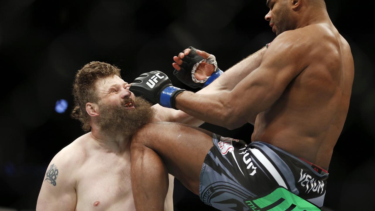 Alistair Overeem, right, of the Netherlands, knees Roy Nelson on the chin during a men's heavyweight UFC 185 mixed martial arts bout, Saturday, March 14, 2015, in Dallas. Overeem won the match in three rounds. (AP Photo/Brandon Wade)