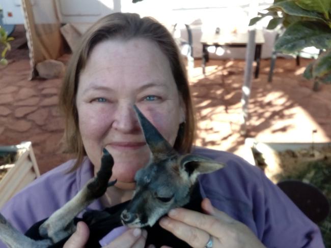 Martha Coodor pictured holding joey kangaroo 'Blue.' Ms Coodor lives with heart disease, and has had quite the ordeal over the last seven years. Image: Jennie Nowell