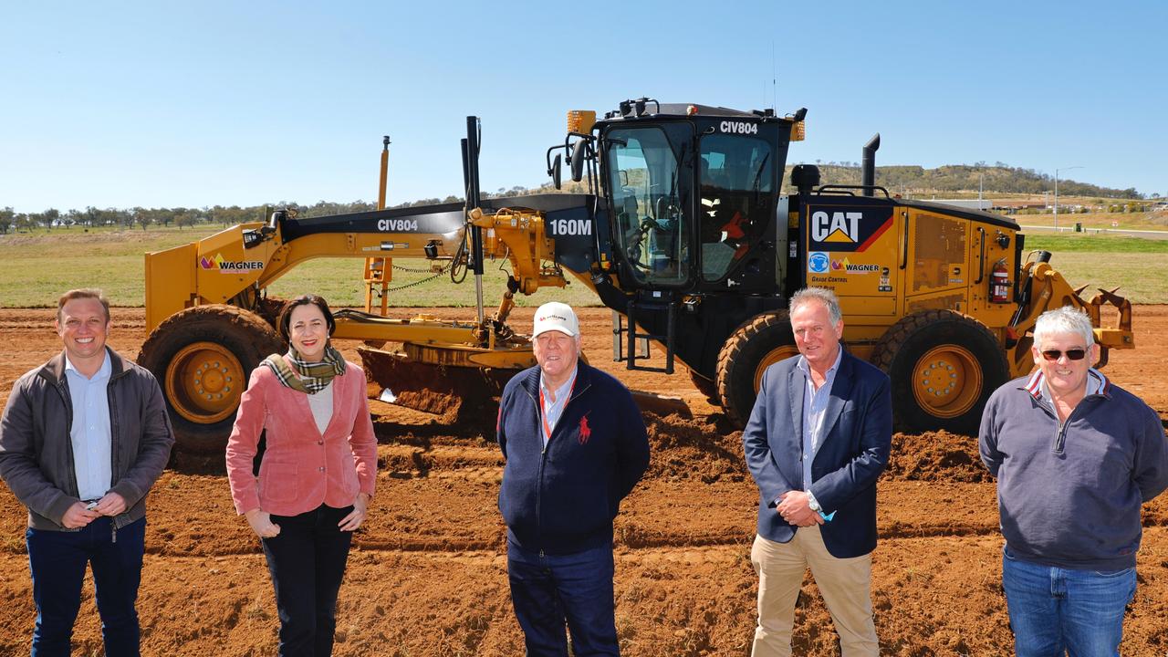 Queensland Premier Annastacia Palaszczuk at the site of a quarantine hub that will be built at Wellcamp Airport in Toowoomba. Also pictured is Deputy Premier Steven Miles, John, Joe and Neill Wagner.