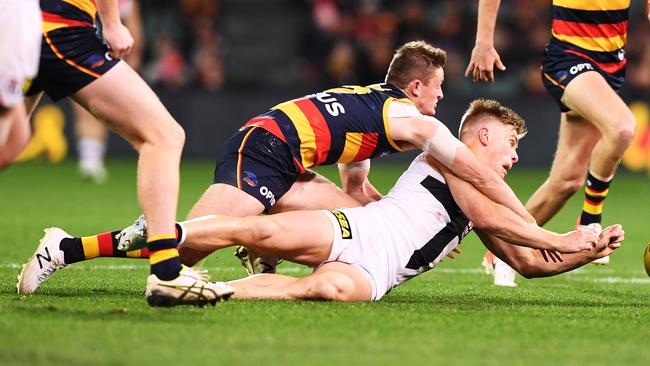 Matt Couch tackles St Kilda midfielder Seb Ross. Picture: Mark Brake/Getty