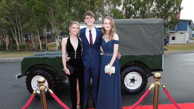 Pacific Pines High formal, at the school. Paige Saurine, Bryce McCalgan and Jade Grey Picture Glenn Hampson