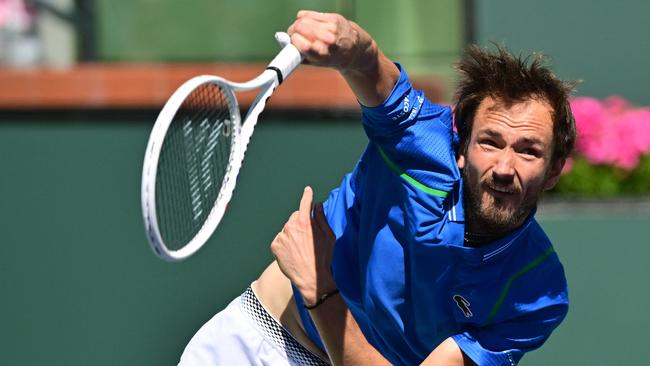 Daniil Medvedev of Russia follows through on a serve to Frances Tiafoe of the US during their Indian Wells Masters semi-final tennis match in Indian Wells, California, on March 18, 2023. (Photo by Frederic J. BROWN / AFP)