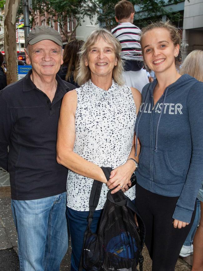 Thousands of people have braved the rain to gather in Brisbane for Anzac Day services. Picture: Grace Kessels