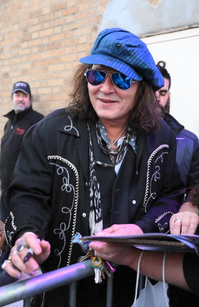 Depp was all smiles as he signed autographs and posed for pictures. Picture: Elder Ordonez/Splash News/Media Mode