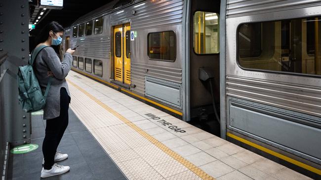 A masked commuter at Sydney’s Town Hall Station. Picture: James Gourley