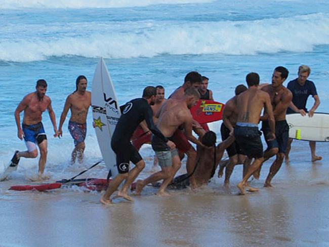 Andre Botha found Evan unconscious in the water and rushed to his aid, reviving him before North Shore lifeguards, along with Mick Fanning, Danny Fuller and Kalani Chapman, helped Evan to the beach. Photo: Jake Howard