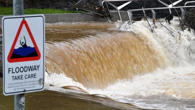 Floodwaters surge down the Parramatta River on Monday. Picture: AFP