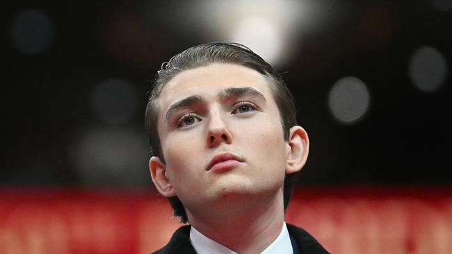 US President Donald Trump' son Barron Trump looks on during the inaugural parade inside Capital One Arena, in Washington, DC, on January 20, 2025. (Photo by Jim WATSON / AFP)