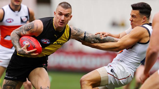 Not even Dylan Shiel can stop a charging Dustin Martin in Round 18. Picture: Michael Klein