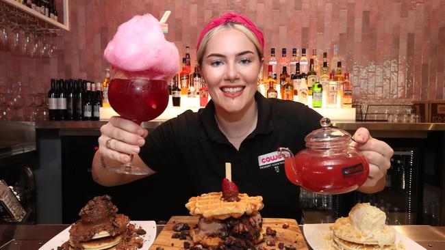 Venue Manager Tarsh Goodwin with some of what's on offer at the new Cowch opening at Oracle Boulevard in Broadbeach. Picture Glenn Hampson