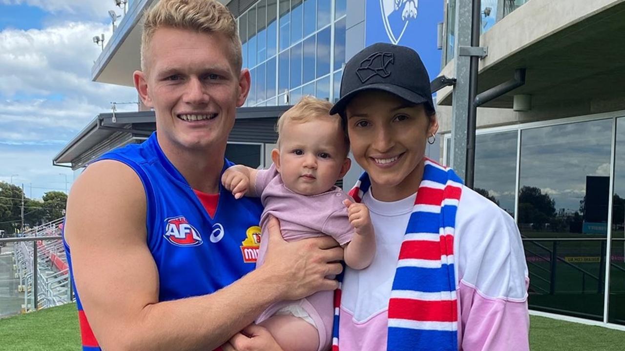 Adam Treloar with daughter Georgie and partner Kim Ravallion.