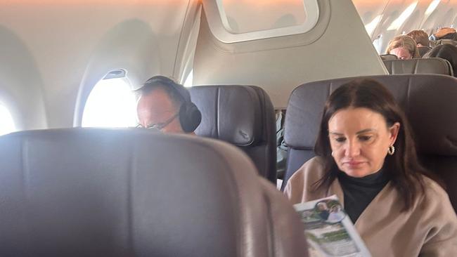 Adam Bandt in the Qantas Business Class next to arch enemy and Senator, Jacqui Lambie.