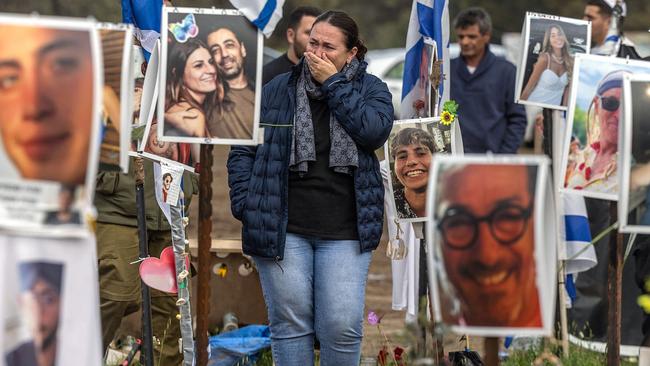 A woman reacts while visiting the site of the Supernova music festival near Kibbutz Reim, southern Israel, on February 19. Thousands of visitors in Israel have been flocking weekly to the site to pay their respects to the 364 people killed there by Hamas in the October 7 attacks. Picture: AFP