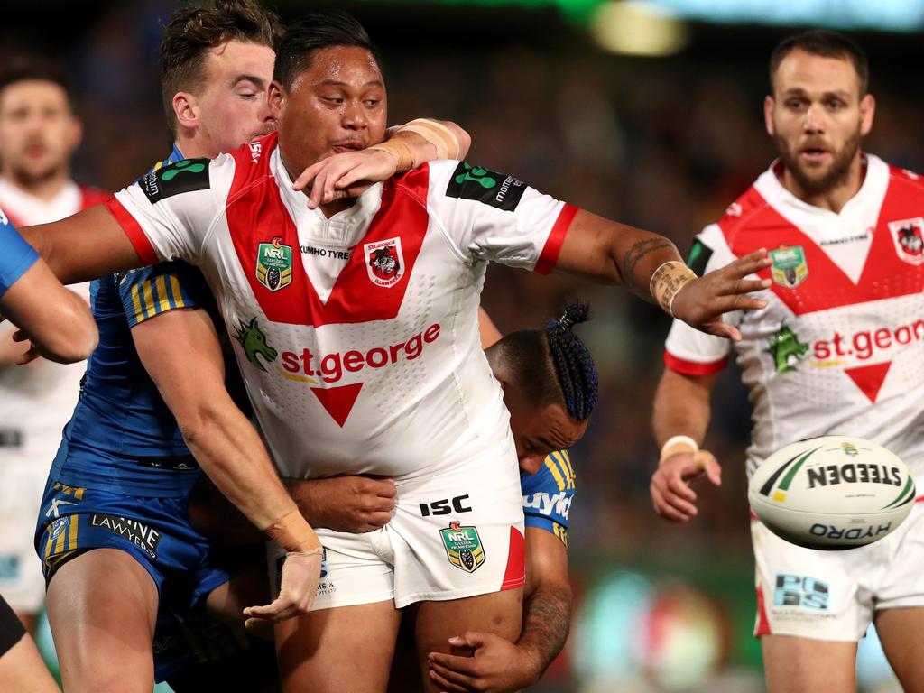 Luciano Leilua lets go of a customary offload during his debut NRL game for the Dragons in 2016. Picture: Gregg Porteous