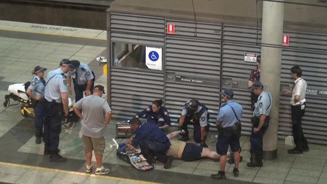 Police and paramedics attend to Callum Brosnan, who died of a suspected overdose after the Knockout Games of Destiny Dance Party. Picture: 7 News