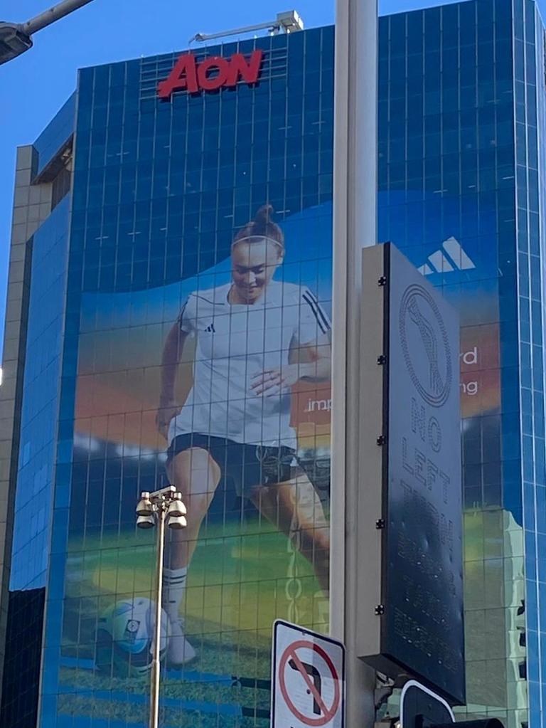 An image of a player is displayed on the AON building.