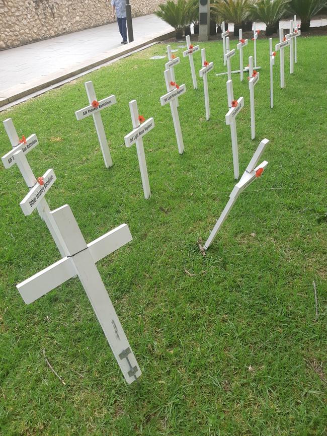 Some crosses were bent and damaged.