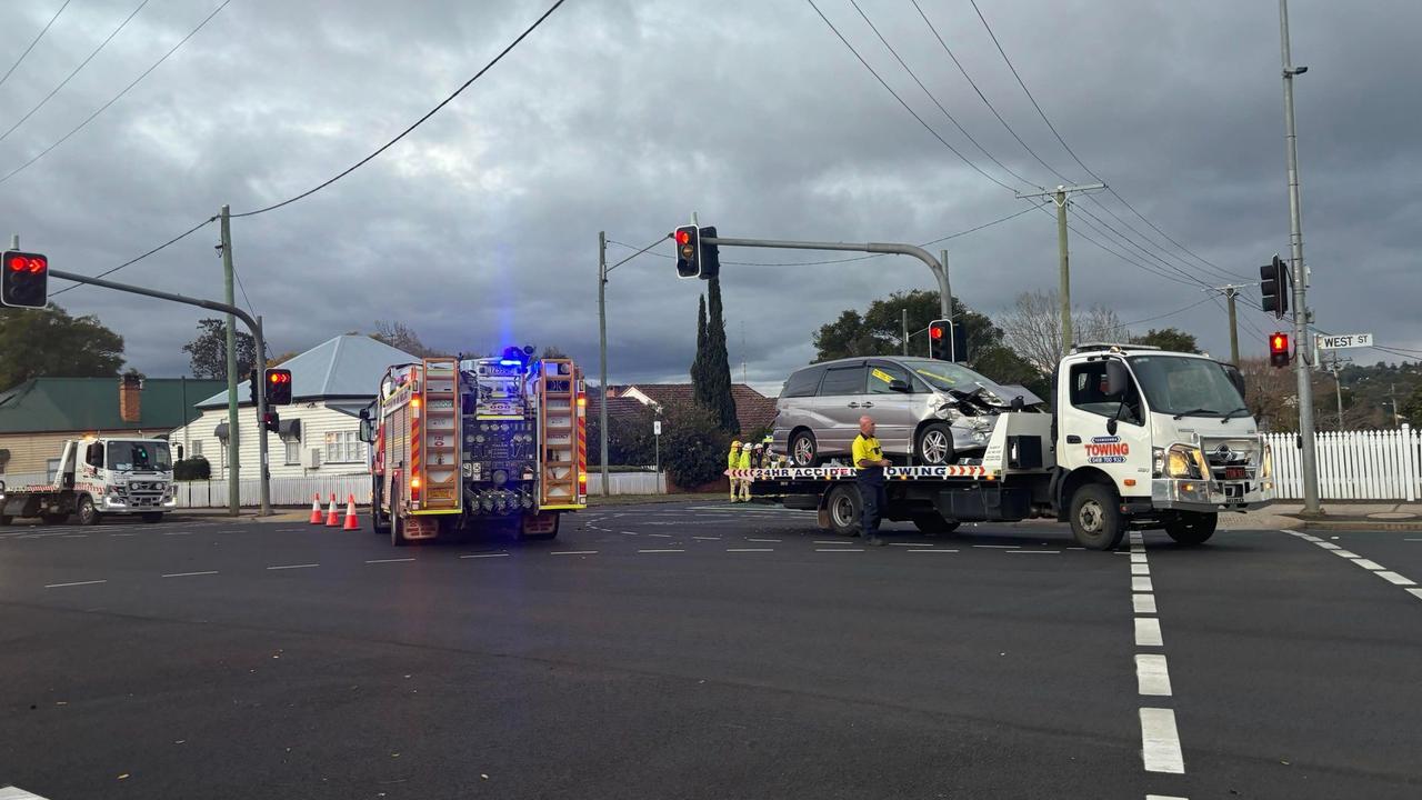 Paramedics assess three patients after busy intersection smash