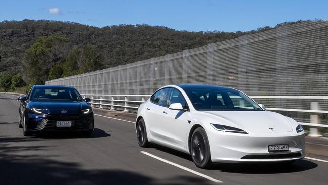 Tesla Model 3 and Toyota Camry Hybrid. Photo: Camber Collective