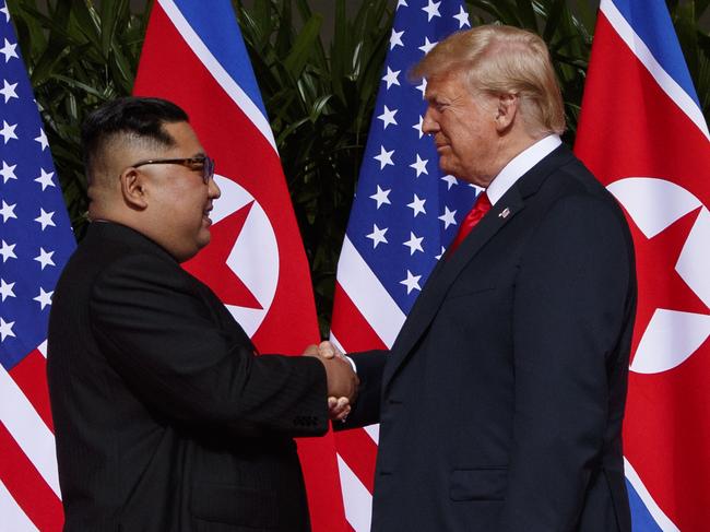 In this Tuesday, June 12, 2018, file photo, U.S. President Donald Trump shakes hands as he meets with North Korean leader Kim Jong Un on Sentosa Island, in Singapore. (AP Photo/Evan Vucci, File)