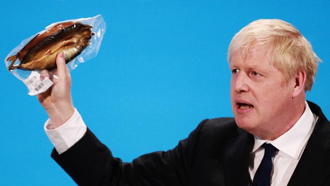 Odd fish: Boris Johnson holds a kipper to illustrate a point during the final hustings of the Conservative leadership campaign in London this week. Picture: Getty Images