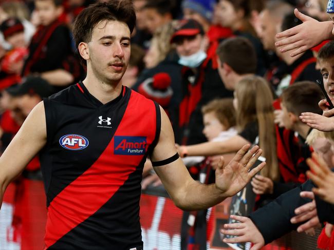 MELBOURNE, AUSTRALIA - JUNE 04: Nic Martin of the Bombers celebrates with fans during the 2023 AFL Round 12 match between the Essendon Bombers and the North Melbourne Kangaroos at Marvel Stadium on June 4, 2023 in Melbourne, Australia. (Photo by Michael Willson/AFL Photos via Getty Images)