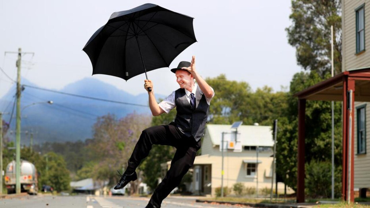 Well-known Tyalgum identity and Flutterbies’ Events manager Solar Chappel puts his own slant on a rain dance in the village's main street as severe water restrictionso come into force. Photo: Scott Powick