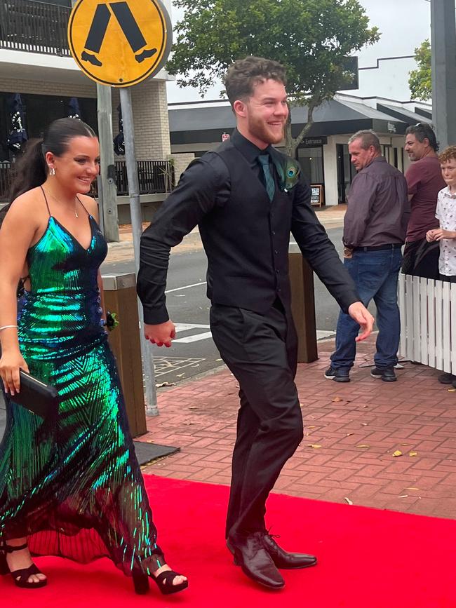 Emma Carter and Kellan arrive at the Urangan State High School formal in a green Holden Kingswood.