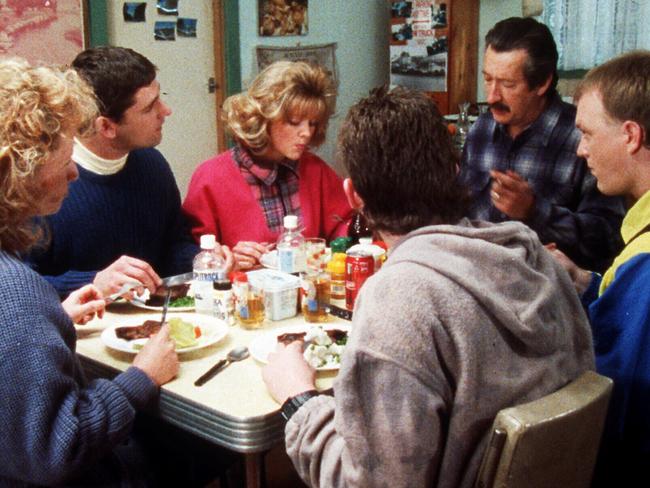 The Kerrigan and Petropoulous families sit down for lunch in a scene from The Castle.