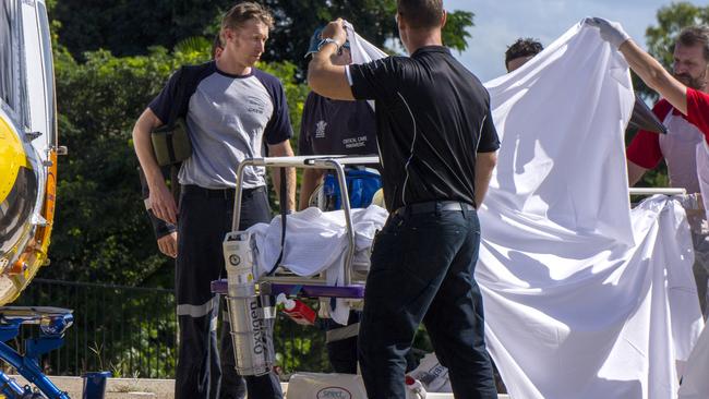 The shark attack victim is transferred to Mackay Base Hospital via RACQRESQ Helicopter. Picture: DARYL WRIGHT.