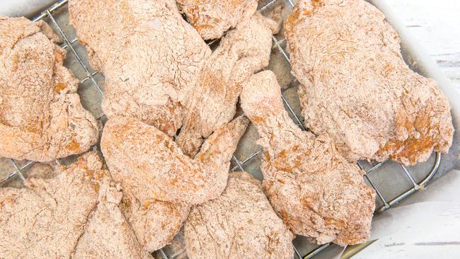 The breaded chicken, ready to be fried. Picture: Tristan Lutze