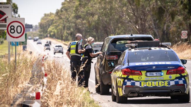 Police pulling over motorists on the Hume Freeway near Wodonga. Picture: Simon Dallinger