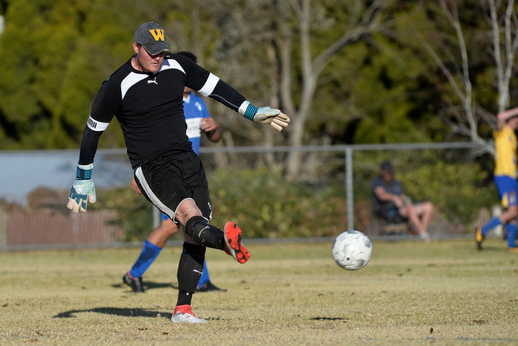 USQ FC keeper Matt Eilers clears the ball against Rockville in Toowoomba Football League Premier Men round 14 at Captain Cook Reserve Des McGovern oval, Sunday, June 24, 2018. Picture: Kevin Farmer