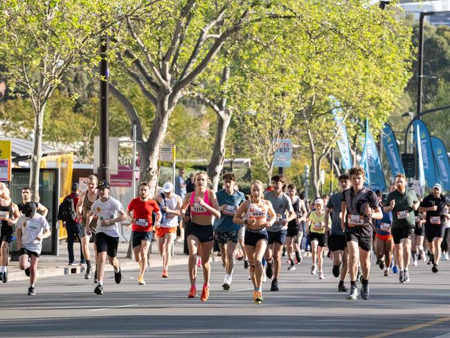 Thousands of runners surge down the fun run course. Picture: Morgan Sette
