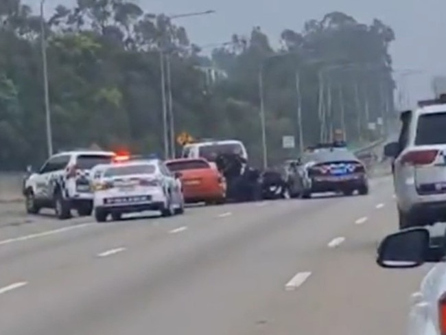 The dramatic moment a man was arrested for driving down the wrong side of the road. Picture: 9News