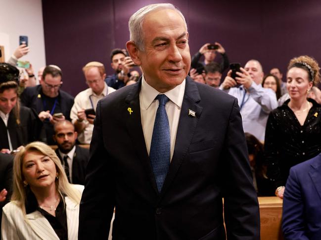 TOPSHOT - Israeli Prime Minister Benjamin Netanyahu attends a hearing in his trial on corruption charges at the district court in Tel Aviv on December 10, 2024. Netanyahu, the first sitting prime minister of Israel to face a criminal trial, testified for the first time when his corruption case resumed on December 10 on charges of bribery, fraud and breach of public trust in three separate cases. (Photo by Menahem Kahana / POOL / AFP)